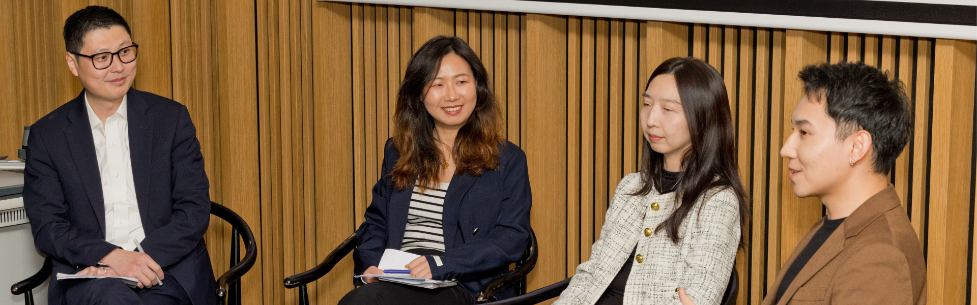 Four UCD alumni speaking on a panel.